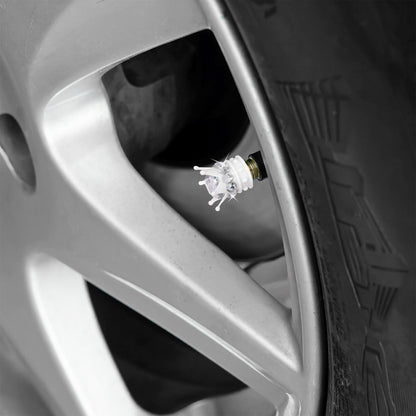 White crown tire valve caps installed on car wheel
